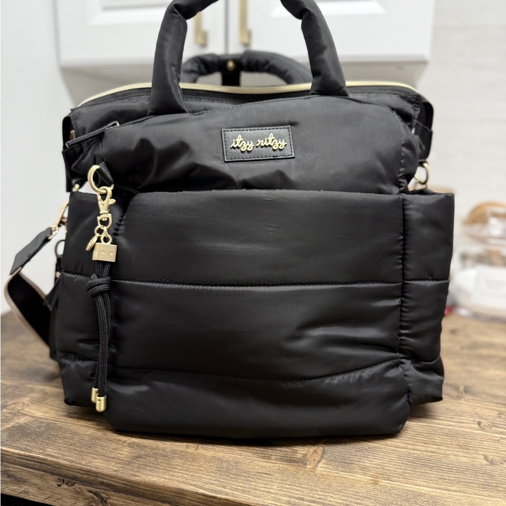 Itzy Ritzy Dream Convertible Backpack- Black Bag with Gold Details